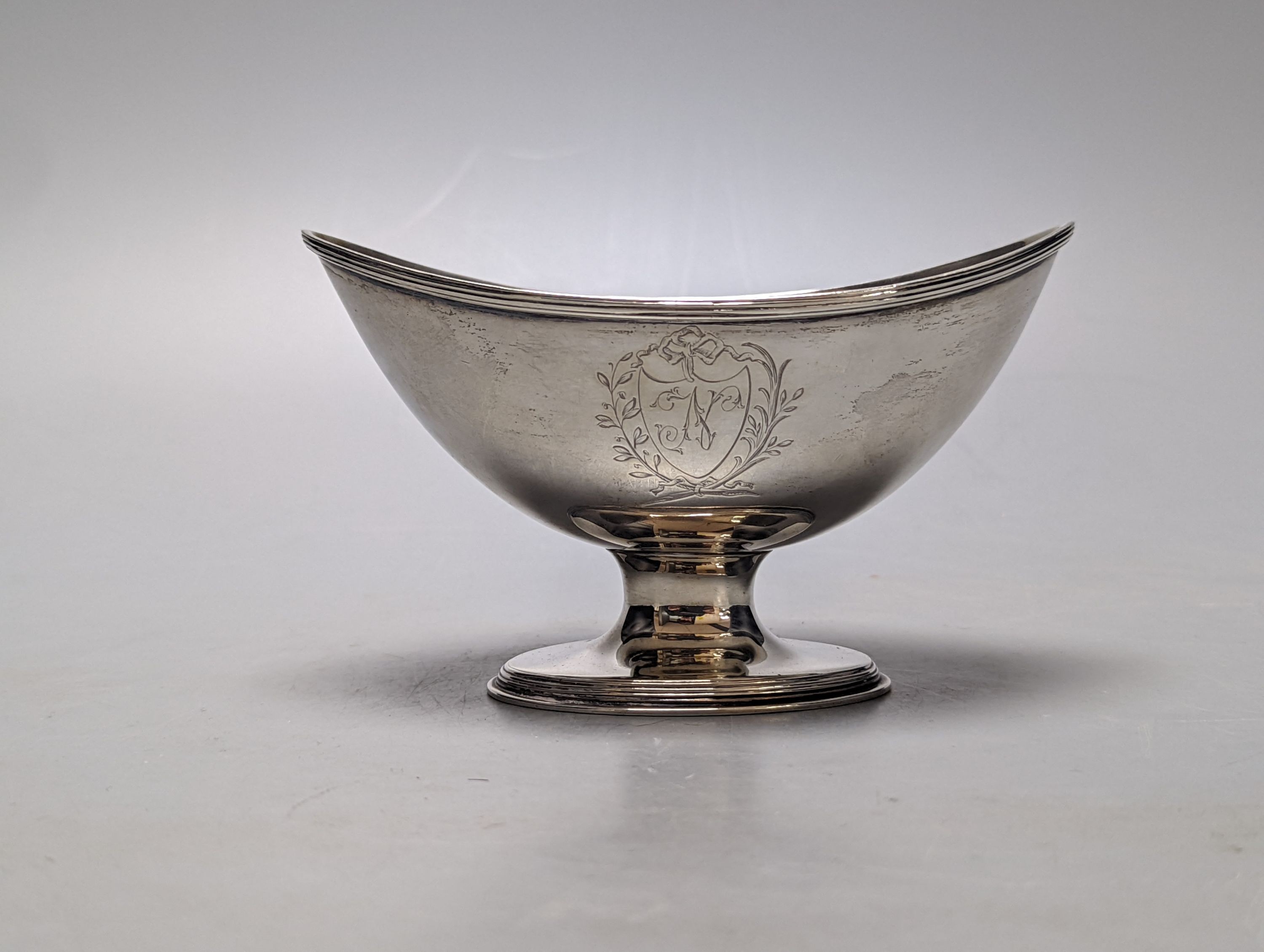 A George III silver sugar bowl, (ex basket), maker's mark double stamped, London, 1790, length 13.6cm